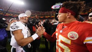 Philadelphia Eagles quarterback Jalen Hurts, left, and Kansas City Chiefs quarterback Patrick Mahomes (15) shake hands following an NFL football game on Monday, Nov. 20, 2023, in Kansas City, Mo. (Charlie Riedel/AP)