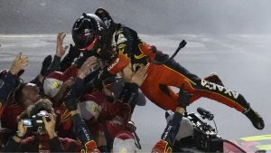 William Byron leaps into his pit crew after winning the NASCAR Daytona 500 auto race Sunday, Feb. 16, 2025, at Daytona International Speedway in Daytona Beach, Fla. (Chris O'Meara/AP)
