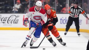 Montreal Canadiens right wing Patrik Laine, left, and Anaheim Ducks center Mason McTavish vie for the puck during the first period of an NHL hockey game, Sunday, Feb. 2, 2025, in Anaheim, Calif. (Mark J. Terrill/AP)