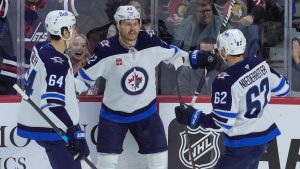 Winnipeg Jets centre Mason Appleton celebrates his goal against the Ottawa Senators with defenceman Logan Stanley and right wing Nino Niederreiter during first period NHL action, Wednesday, Feb. 26, 2025 in Ottawa. (THE CANADIAN PRESS/Adrian Wyld)