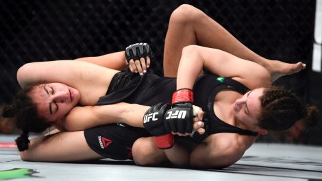 Montana-De-La-Rosa-applies-an-armour-to-Nadia-Kassem-during-their-women's-flyweight-mixed-martial-arts-bout-at-UFC-234-in-Melbourne,-Australia-in-2019