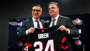 Ottawa Senators general manager Steve Staios (left) announces Travis Green as the team's new head coach in Ottawa on Wednesday, May 8, 2024. (Sean Kilpatrick/CP)