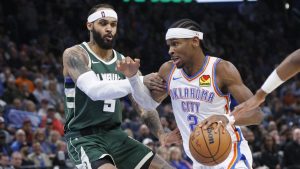 Oklahoma City Thunder guard Shai Gilgeous-Alexander, right, drives against Milwaukee Bucks guard Gary Trent Jr., left, during the second half of an NBA basketball game Monday, Feb. 3, 2025, in Oklahoma City. (Nate Billings/AP)
