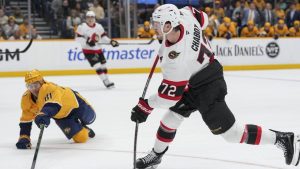 Ottawa Senators defenseman Thomas Chabot (72) shoots the puck past Nashville Predators center Jonathan Marchessault (81) during the first period of an NHL hockey game Monday, Feb. 3, 2025, in Nashville, Tenn. (George Walker IV/AP)
