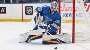 St. Louis Blues goaltender Jordan Binnington (50) makes a play on the puck against the Dallas Stars during the first period of an NHL hockey game on Saturday, Jan. 25, 2025, in St. Louis. (Joe Puetz/AP)