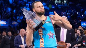 Golden State Warriors guard Stephen Curry holds the Most Valuable Player trophy after the NBA All-Star basketball game Sunday, Feb. 16, 2025, in San Francisco. (AP Photo/Godofredo A. Vásquez)