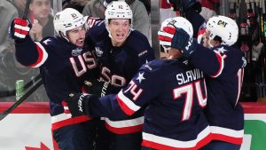 United States' Dylan Larkin (left) celebrates his goal against Canada with Matt Boldy, left to right, Jaccob Slavin and Brock Faber during second period 4 Nations Face-Off hockey action in Montreal on Saturday, Feb. 15, 2025. (Christinne Muschi/CP)