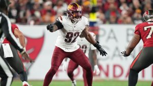 Washington Commanders defensive tackle Jonathan Allen (93) directs a teammate during a play during an NFL football Wild Card playoff game against the Tampa Bay Buccaneers , Sunday, Jan 12, 2025, in Tampa, Fla. (Peter Joneleit/AP)