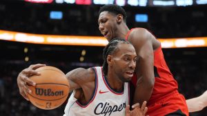 Los Angeles Clippers forward Kawhi Leonard (2) tries to get around Toronto Raptors guard RJ Barrett (9) during first half NBA action in Toronto on Sunday, Feb. 2, 2025. (Frank Gunn/THE CANADIAN PRESS)