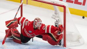 Canada goaltender Jordan Binnington (50) stretches to make a save against the United States during first period 4 Nations Face-Off hockey action in Montreal on Saturday, Feb. 15, 2025. (Christinne Muschi/CP)