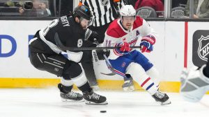 Los Angeles Kings defenceman Drew Doughty, left, and Montreal Canadiens right wing Brendan Gallagher vie for the puck during the third period of an NHL hockey game, Wednesday, Feb. 5, 2025, in Los Angeles. (Mark J. Terrill/AP Photo)