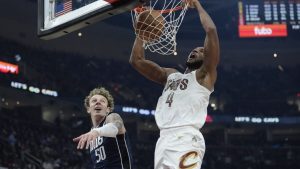 Cleveland Cavaliers forward Evan Mobley (4) dunks in front of Dallas Mavericks centre Kylor Kelley (50) in the first half of an NBA basketball game, Sunday, Feb. 2, 2025, in Cleveland. (Sue Ogrocki/AP)
