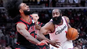 LA Clippers guard James Harden, right, drives against Chicago Bulls guard Coby White during the second half of an NBA basketball game in Chicago, Wednesday, Feb. 26, 2025. (Nam Y. Huh/AP)