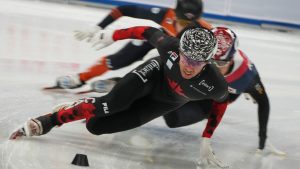 William Dandjinou of Canada leads as he competes in the heats of the Men's 500-meter at the ISU World Tour Short Track Speed Skating held at the Capital Indoor Stadium in Beijing, Friday, Dec. 6, 2024. (Andy Wong/AP)