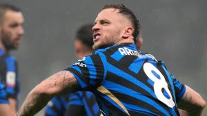 Inter Milan's Marko Arnautovic celebrates after scoring his side's opening goal during an Italian Cup quarter final soccer match between Inter Milan and Lazio, at the San Siro stadium in Milan, Italy, Tuesday, Feb. 25, 2025. (Luca Bruno/AP Photo)