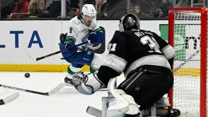 Vancouver Canucks right wing Conor Garland (8) shoots against Los Angeles Kings goaltender David Rittich (31) during the first period of an NHL hockey game in Los Angeles, Wednesday, Feb. 26, 2025. (Alex Gallardo/AP)