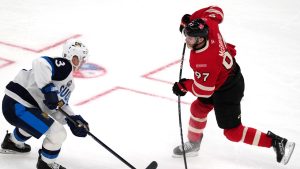 Canada's Connor McDavid (97) takes a shot against Finland's Olli Maatta during the first period of a 4 Nations Face-Off hockey game, Monday, Feb. 17, 2025, in Boston. (Charles Krupa/AP Photo)