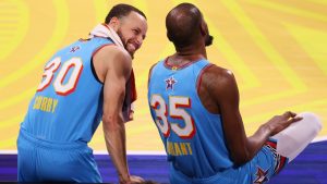 Golden State Warriors guard Stephen Curry talks to Phoenix Suns forward Kevin Durant during the NBA All-Star basketball game Sunday, Feb. 16, 2025, in San Francisco. (Jed Jacobsohn/AP)