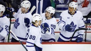 Toronto Maple Leafs' William Nylander (88) celebrates his goal with teammates during second period NHL hockey action against the Calgary Flames in Calgary on Tuesday, Feb. 4, 2025. (Jeff McIntosh/THE CANADIAN PRESS)