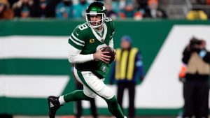 New York Jets quarterback Aaron Rodgers (8) looks to pass the ball during an NFL football game against the Miami Dolphins Sunday, Jan. 5, 2025, in East Rutherford, N.J. (Adam Hunger/AP)