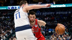 Chicago Bulls guard Zach LaVine, right, drives against Dallas Mavericks guard Luka Doncic (77) during the first half of an NBA basketball game in Dallas, Wednesday, Nov. 1, 2023. (Michael Ainsworth/AP)