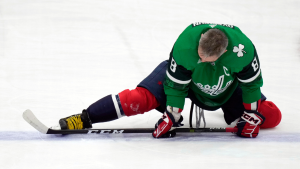 Washington Capitals left wing Alex Ovechkin stretches during warmups prior to an NHL game against the St. Louis Blues, Friday, March 17, 2023, in Washington. Ovechkin wears a green jersey for St. Patrick's Day. (AP/Carolyn Kaster)