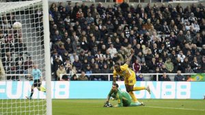 Brighton and Hove Albion's Danny Welbeck, right, scores their side's second goal during the FA Cup fifth round match between Newcastle United and Brighton and Hove Albion at St James' Park, Newcastle, England, Sunday, March 2, 2025. (Owen Humphreys/PA via AP)