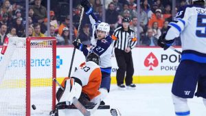 Winnipeg Jets' Nikolaj Ehlers (27) scores a goal against Philadelphia Flyers' Samuel Ersson (33) during the first period of an NHL hockey game Thursday, March 6, 2025, in Philadelphia. (Matt Slocum/AP)