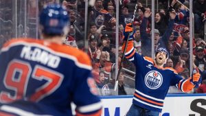 Edmonton Oilers' Evan Bouchard (2) celebrates his game-winning goal against the Montreal Canadiens during overtime NHL action in Edmonton on Thursday, March 6, 2025. (Jason Franson/CP)