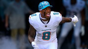 Miami Dolphins safety Jevon Holland (8) yells as he runs onto the field during player introductions before an NFL football game against the New York Jets, Sunday, Dec. 8, 2024, in Miami Gardens, Fla. (Doug Murray/AP)