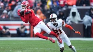 Kansas City Chiefs wide receiver DeAndre Hopkins catches a pass in front of Cleveland Browns cornerback Denzel Ward (21) in the first half of an NFL football game in Cleveland, Sunday, Dec. 15, 2024. (AP Photo/Sue Ogrocki)