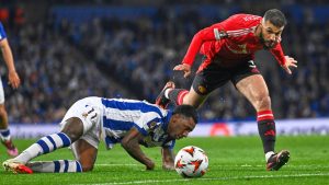 Real Sociedad's Sheraldo Becker challenges for the ball with Manchester United's Noussair Mazraoui during the Europa League round of 16 first leg soccer match between Real Sociedad and Manchester United at the Reale Arena in San Sebastian, Spain, Thursday, March 6, 2025. (Miguel Oses/AP)