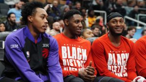 Toronto Raptors' Scottie Barnes, left to right, RJ Barrett and Immanuel Quickley sit on the bench during second half NBA basketball action against the Cleveland Cavaliers in Toronto on Wednesday, February 12, 2025. (Frank Gunn/CP)