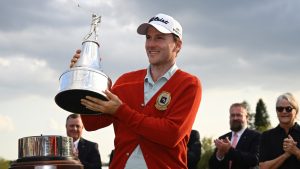 Russell Henley holds the championship trophy after winning the Arnold Palmer Invitational at Bay Hill golf tournament, Sunday, March 9, 2025, in Orlando, Fla. (AP/Phelan M. Ebenhack)