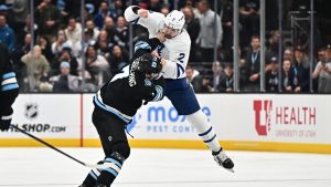 Simon Benoit of the Toronto Maple Leafs fights against Michael Kesselring of the Utah Hockey Club during the second period of a game on March 10, 2025 at Delta Center in Salt Lake City, Utah. (Jamie Sabau/NHLI via Getty Images)