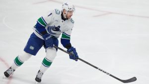 Vancouver Canucks defenceman Carson Soucy (7) skates with the puck during the third period of an NHL hockey game against the Dallas Stars Friday, Jan. 31, 2025, in Dallas. (LM Otero/AP)