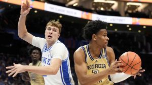 Georgia Tech guard Jaeden Mustaf drives to the basket past Duke forward Cooper Flagg during the first half of an college basketball game in the quarterfinals of the Atlantic Coast Conference tournament. (Chris Carlson/AP)