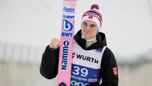 Marius Lindvik, of Norway, poses after winning the silver medal in the ski jumping men's large hill individual competition at the Nordic World Ski Championships in Trondheim, Norway, Saturday, March 8, 2025. (Matthias Schrader/AP)