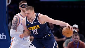 Denver Nuggets centre Nikola Jokic (15) goes to the basket against Oklahoma City Thunder centre Isaiah Hartenstein during the first half of an NBA basketball game Monday, March 10, 2025, in Oklahoma City. (Nate Billings/AP)