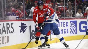 Washington Capitals left wing Alex Ovechkin (8) and Tampa Bay Lightning center Gage Goncalves, right, battle along the boards during the first period of an NHL hockey game. (Nick Wass/AP)