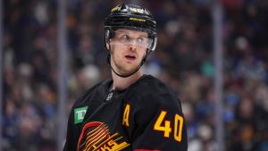 Vancouver Canucks' Elias Pettersson waits for a faceoff against the St. Louis Blues during the second period of an NHL hockey game in Vancouver on December 10, 2024. (Darryl Dyck/CP)