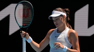 FILE - Emma Raducanu of Britain reacts during her third round match against Iga Swiatek of Poland at the Australian Open tennis championship in Melbourne, Australia, Saturday, Jan. 18, 2025. (Asanka Brendon Ratnayake/AP)